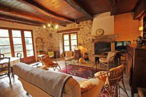 a living room with a couch and a fireplace at Beaufort in Blond