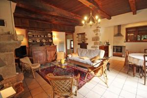 a living room with a couch and a table at Beaufort in Blond +21 photos