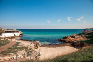 a walkway leading to the ocean on a cliff at B&B Portorosso in Monopoli