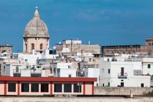a group of white buildings with a dome on top at B&B Portorosso in Monopoli