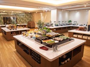 a buffet line in a restaurant with food on display at Fuji Matsuzono Hotel in Yamanakako