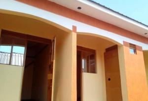 a house with an open door to a room at Jayson Housing in Wakiso