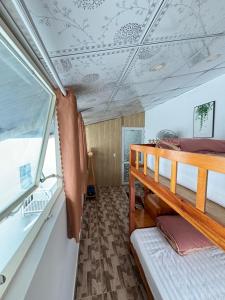 a bedroom with a bunk bed on a boat at Blue Windy Đà Lạt Homestay in Da Lat