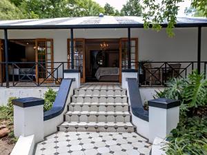 a home with a staircase leading to a house at The Tin Roof in Riebeek-Kasteel