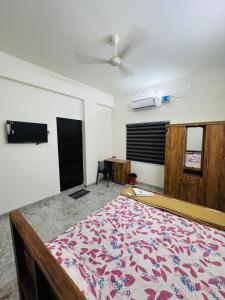 a bedroom with a large bed in a room at Dubai Inn in Kanjirapalli