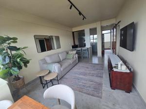 a living room with a couch and a table at 407 Afsaal in Amanzimtoti