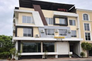 a hotel building with a hotel sign on it at The Golden Wings Hotel in Dewās +26 photos