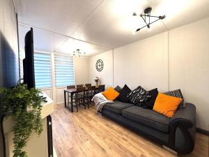 a living room with a couch and a table at Bayside in Bridlington +23 photos