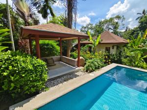 a villa with a swimming pool and a gazebo at Private Balinese Bungalow for 2 - Shared pool - Lamai Koh Samui in Nathon Bay