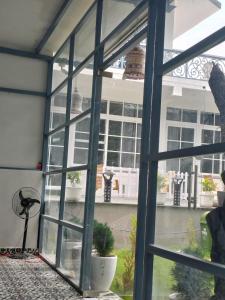 an open window with a view of a building at leisure valley resort in Jhājra
