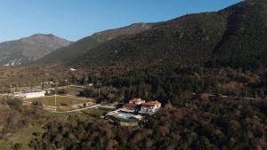 an aerial view of a house in the mountains at Agnanti Hotel in Velventós