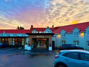 a hotel with a car parked in front of it at The Fenwick Hotel in Kilmarnock