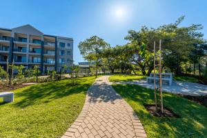 a brick walkway in front of a building at Luxury Spa unit, Private Sauna, Central Ballito in Ballito