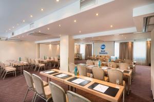 a conference room with tables and chairs in a room at Best Western Hotel zur Post in Bremen +53 photos
