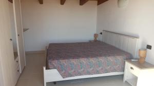 Postel nebo postele na pokoji v ubytování Terrazza sul golfo degli angeli