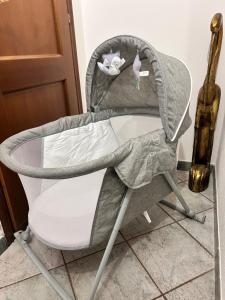 a chair with a table in a room at B&B Ginepro blu in Portoscuso +41 photos
