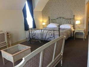 Ένα ή περισσότερα κρεβάτια σε δωμάτιο στο The Beaumont Accommodation