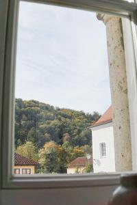 a window with a view of a mountain at FelsenSuite Panorama Essing in Essing
