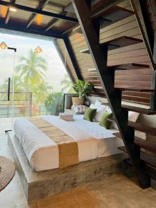a bedroom with a large bed in a room at Kurunda Estate Villa in Tangalle