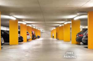 a parking garage with many cars parked in it at CZECH INN Hotel Ferenc in Budapest