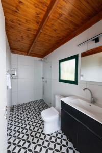 a bathroom with a white toilet and a sink at מצפה השלום in Kfar Haruv +13 photos