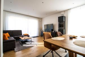 a living room with a couch and a table at Residenz Mont Royal in Traben-Trarbach