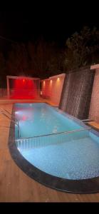 a large swimming pool at night with at ADAM'S FORT by Dell'amore Havn in Vagamon