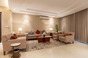 a living room with couches and chairs and a table at Imperial - إمبريال in Riyadh