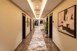 a corridor of an office with a long hallway at Imperial - إمبريال in Riyadh