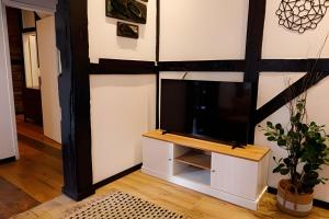 a living room with a tv on a wall at Casa Enxaimel em Pomerode SC 01 in Pomerode