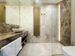 a bathroom with a shower and a sink at Apartament - Vidok 301 in Olsztyn +12 photos