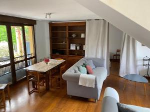 a living room with a couch and a table at La Venta in Arguedes