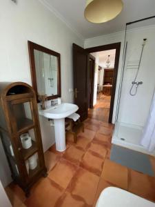 a bathroom with a sink and a shower at La Venta in Arguedes +23 photos