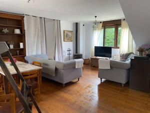a living room with two couches and a table at La Venta in Arguedes