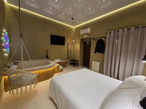a bedroom with two beds and a swing at Erbanova al Borgo Suite in Taranto