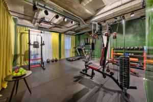 a fitness room with a gym with a treadmill at Max Brown Hotel Downtown Part of Sircle Collection Formally known as Dave Red in Athens