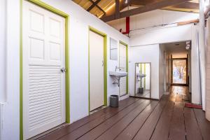 an empty room with white walls and a door at Searyn Lanta in Ko Lanta