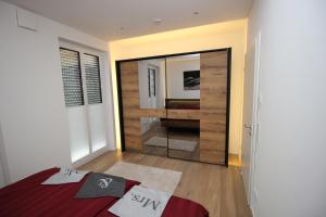 a bedroom with a large mirror in a room at Residenz Mont Royal in Traben-Trarbach