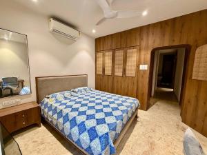 a bedroom with a bed and a dresser and a mirror at Shobhalay- Premium 2BHK Parking prime location super interior in Rānchī