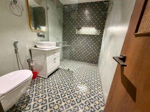 a bathroom with a sink and a toilet at Shobhalay- Premium 2BHK Parking prime location super interior in Rānchī