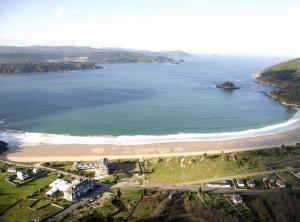 an aerial view of a beach and the ocean at Winahost Ático Viveiro in Viveiro