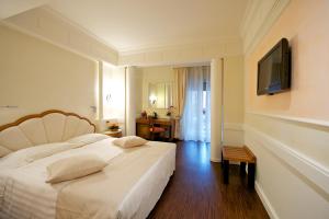 Postel nebo postele na pokoji v ubytování Hotel Stendhal