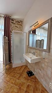 a bathroom with a sink and a shower at Fayollas in Bussière-Galant +29 photos