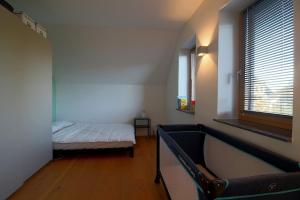 a bedroom with a bed and a large window at WK7 "Ferienwohnung Küstenruhe" in Dorum +9 photos