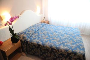 Postel nebo postele na pokoji v ubytování Hotel Moderno