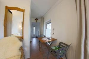 a living room with a table and chairs at NS 6a Seestern Wremen in Wremen