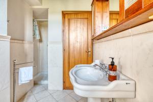 a bathroom with a white sink and a shower at Casale Rialto in Montefalco +119 photos
