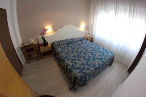 Postel nebo postele na pokoji v ubytování Hotel Moderno