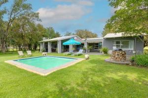 a house with a swimming pool in the yard at Vaal River House @ Lochvaal in Vanderbijlpark