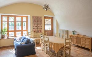 a living room with a table and a dining room at Les Yourtes de Provence in Saint-Paulet-de-Caisson